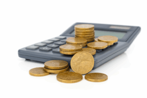 Borrowing Power Calculator with Australian Dollar Coins | Find A Better Rate Home Loans Australian dollar coins on a calculator representing a home loan borrowing power calculator and mortgage affordability in Australia