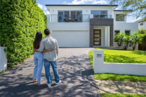 First home buyers viewing a modern Australian property while exploring first home buyer stamp duty exemption savings