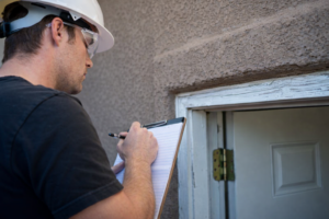 Building and pest inspection being carried out on a residential property to identify structural issues and termite risks before purchase