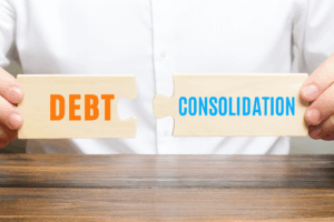 Hands holding puzzle pieces labelled Debt and Consolidation, symbolising debt consolidation loans that combine multiple debts into one manageable repayment.