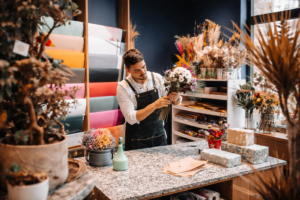 Mortgage brokers for self employed borrowers reviewing business income and loan documents in a professional workspace