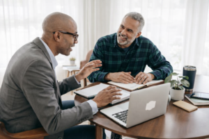 Mortgage loan broker meeting with a client to discuss home loan options and borrowing strategy