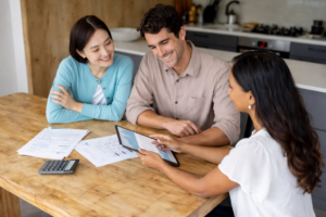 Mortgage broker explaining home loan options to first home buyers during a consultation in Melbourne